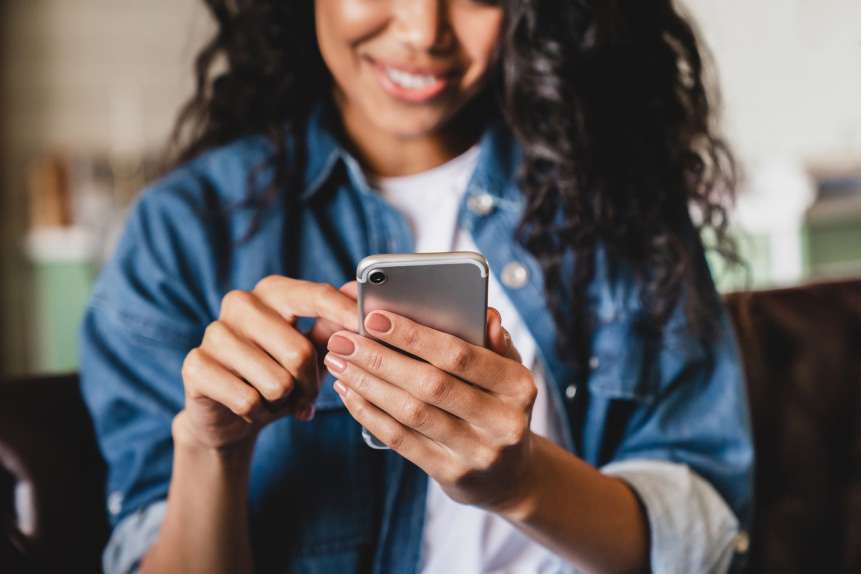 young woman using Dash rules-based patient scheduling software