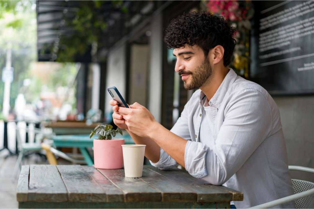 young man in case using smartphone for online patient self-scheduling