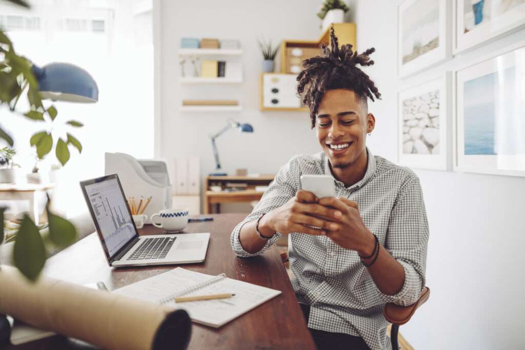 african american man using smart phone for patient self-scheduling software