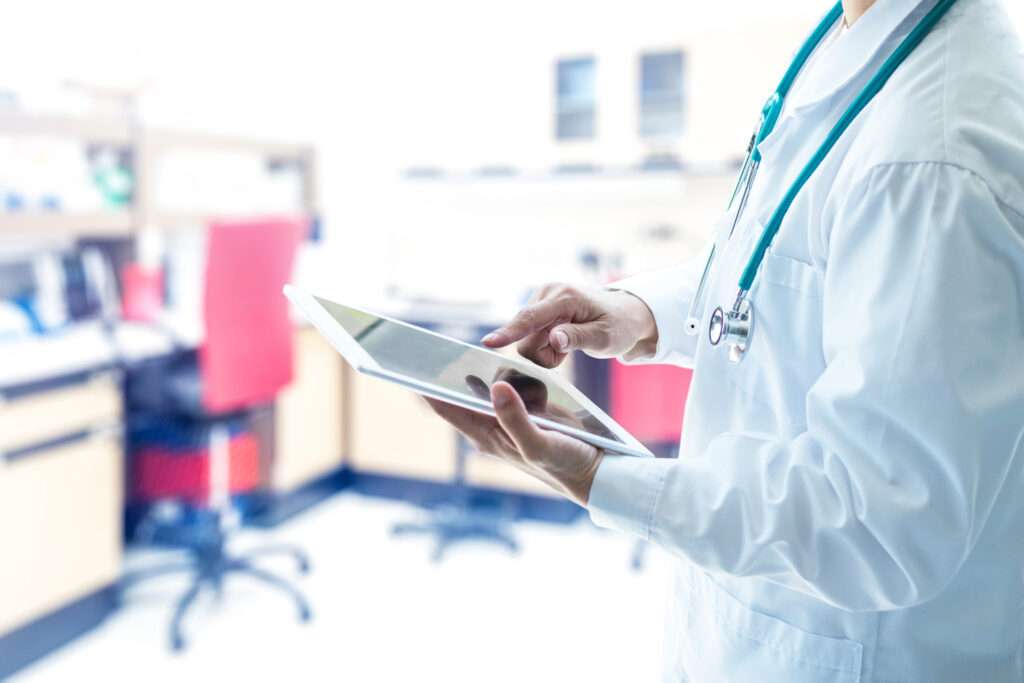 doctor using Intake Software on tablet