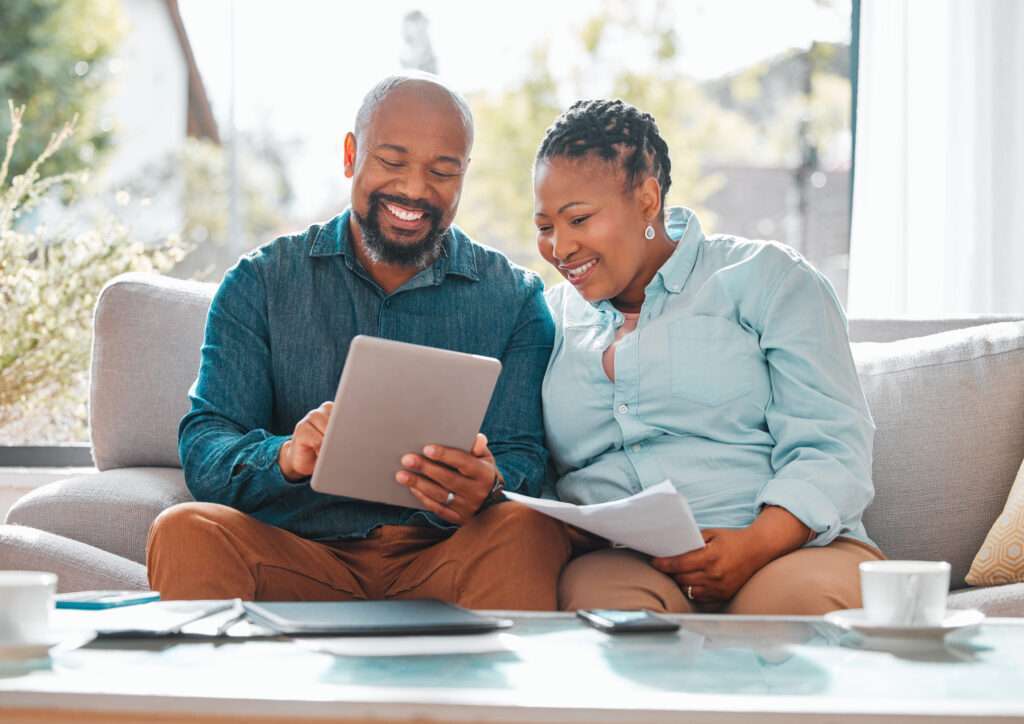 Couple using tablet for online medical staff scheduling