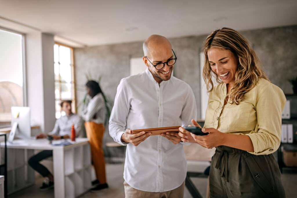 couple using appointment patient self scheduling software on smart phone