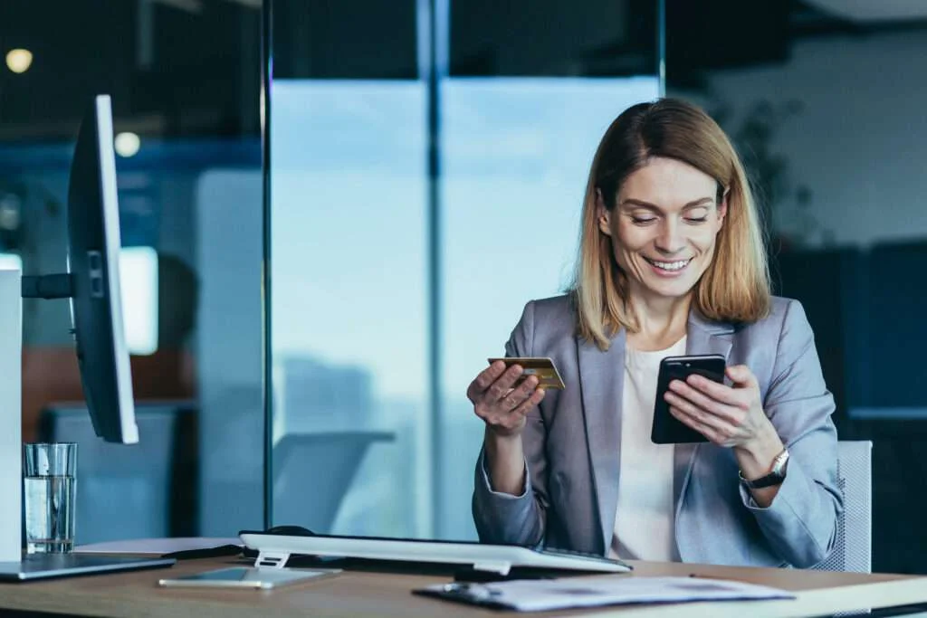 businesswoman using only medical payments software to pay bill on smart phone