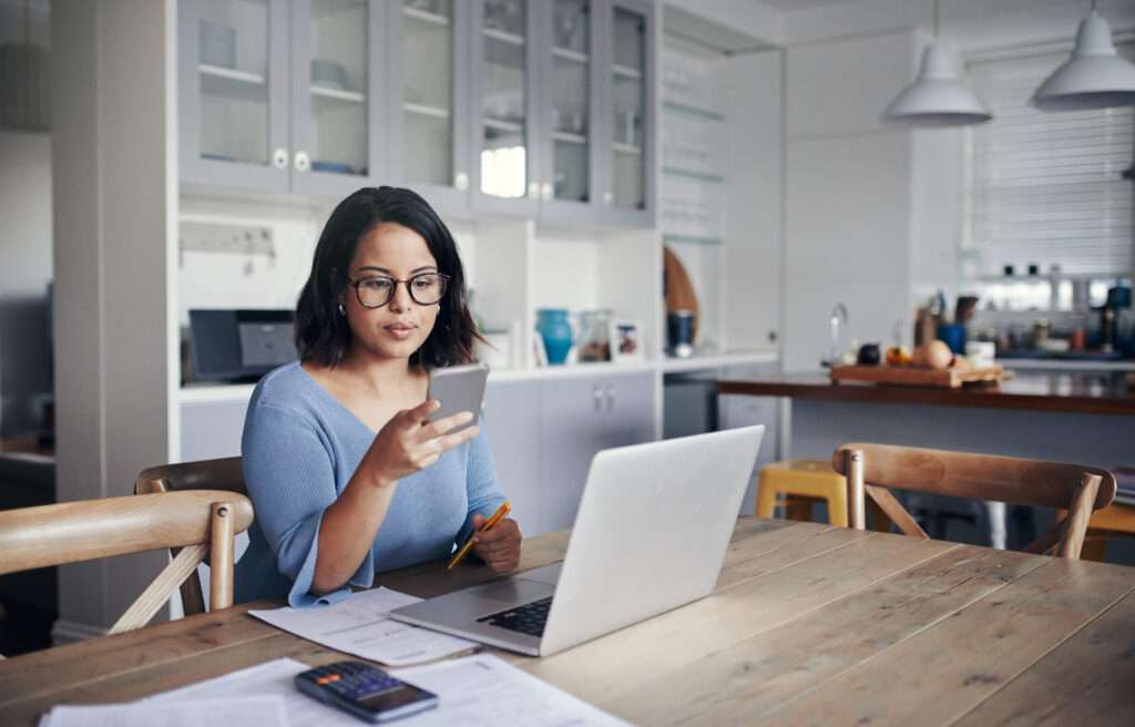 woman using smartphone with patient appointment reminder software