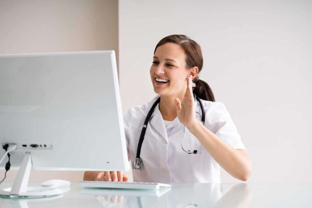 doctor happily using online patient appointment booking
