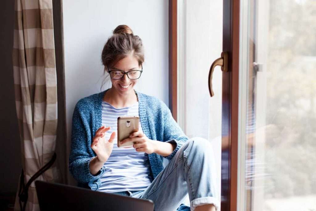 woman using Patient Success Platform on smart phone