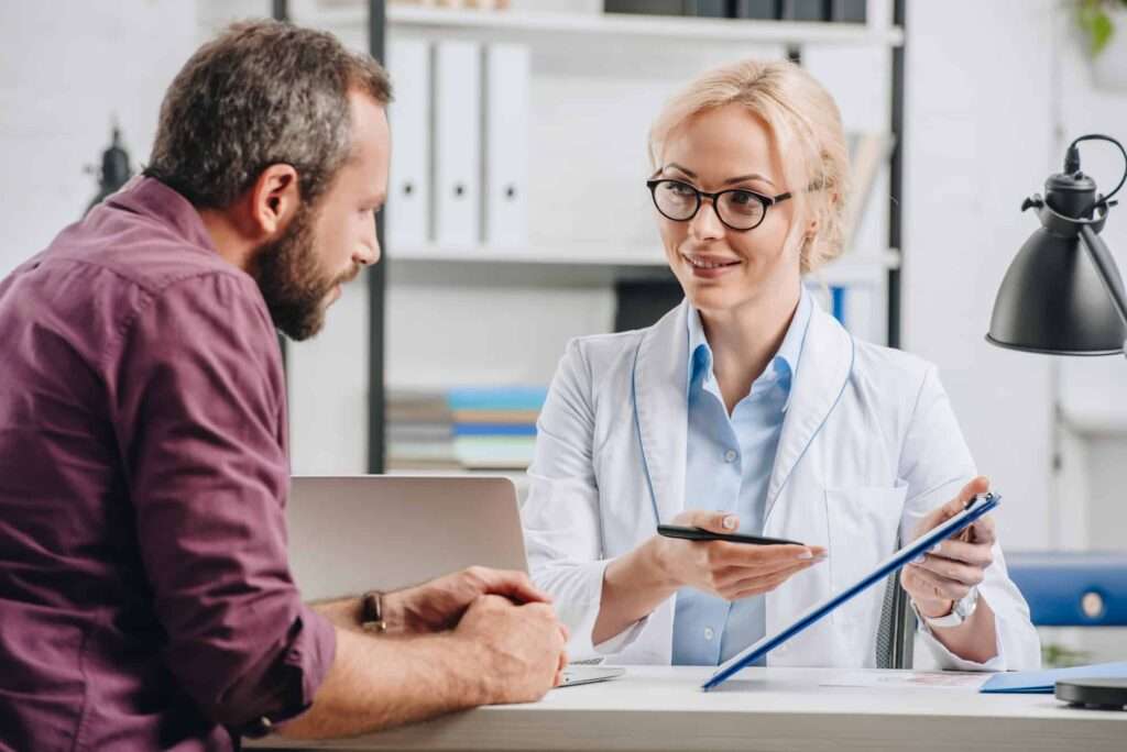 female doctor demonstrating patient scheduling platform on tablet