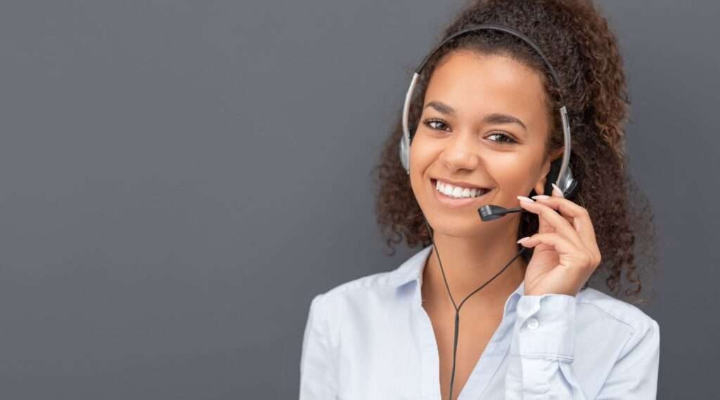 automated contact center scheduling saves time from woman being on phone headset