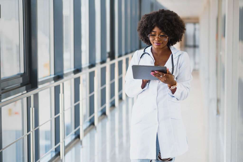 doctor using tablet with best patient self scheduling software
