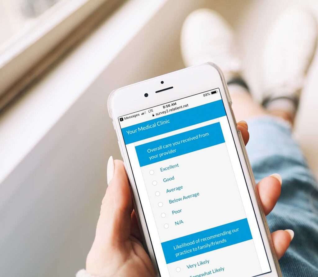 person holding smart phone using patient care reviews software
