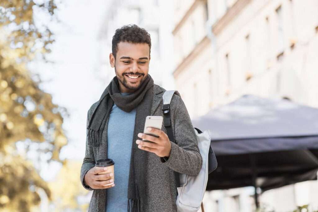 man using Dash Chat on mobile phone to keep patients connected during COVID