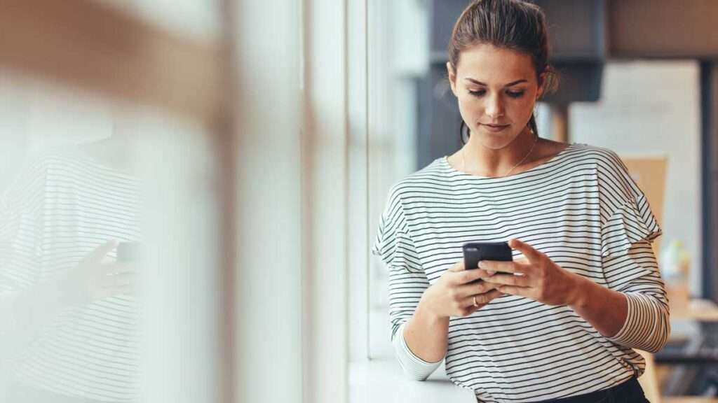 woman using Patient Engagement Platform on cell phone