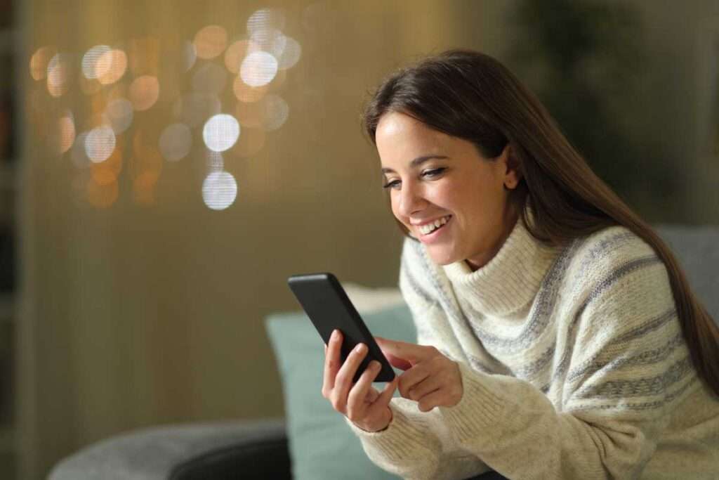 woman using integrated patient engagement platform on cell phone