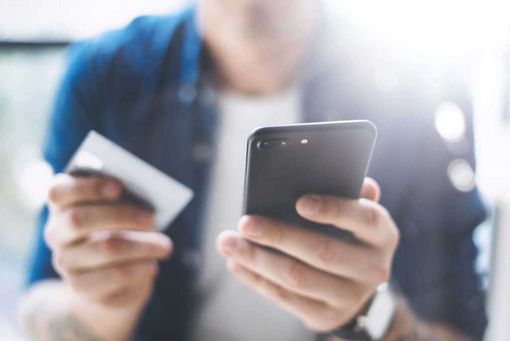 man using cell phone to improve patient engagement