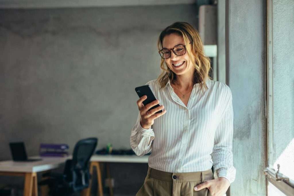 woman on smart phone using Patient Check-In Solution