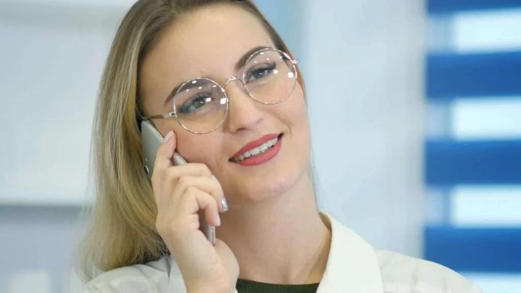 Scheduling Doctor Appointments woman using mobile phone to schedule doctors appointments using voice ai agent