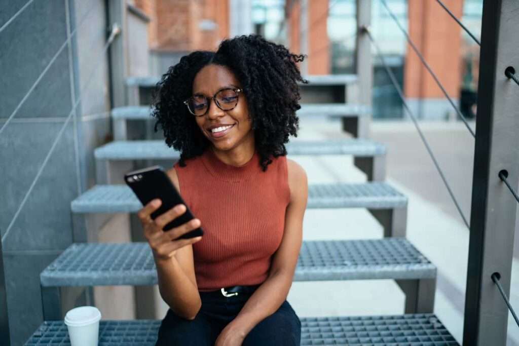 woman using cell phone for patient communication