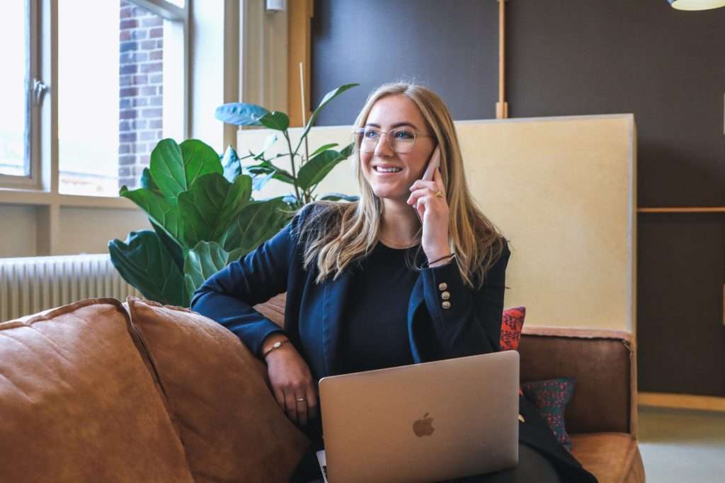 professional woman on phone discussing staff scheduling software for healthcare