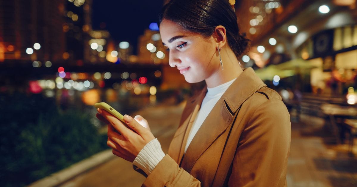woman using mobile device for self-scheduling medical appointments online
